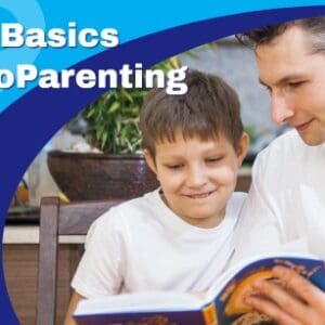 The Basics of CoParenting course banner featuring a father looking at a book with his son who is excited and be reading.